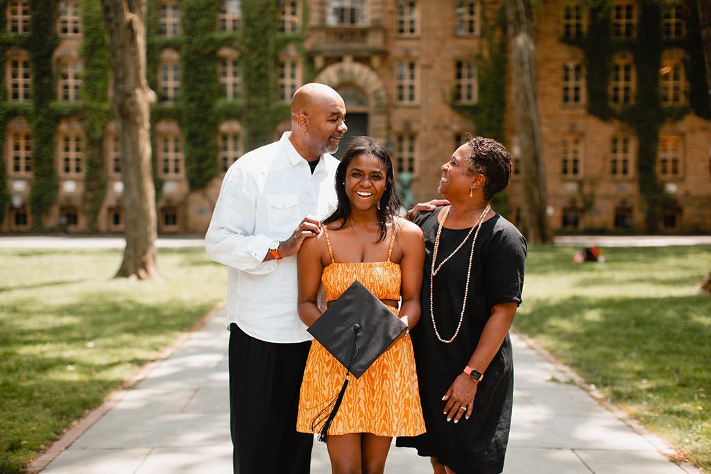 Monica Moore Thompson with husband John Thompson III and daughter Morgan in front of Nassau Hall