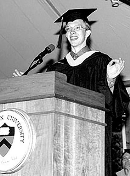 Andrew Houck speaking to his fellow graduates from the commencement podium in 2000.